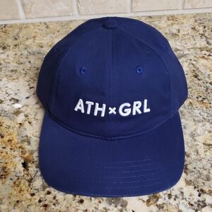 Athleta Girl baseball cap in Navy Blue, featuring White "ATH x GRL" embroidery